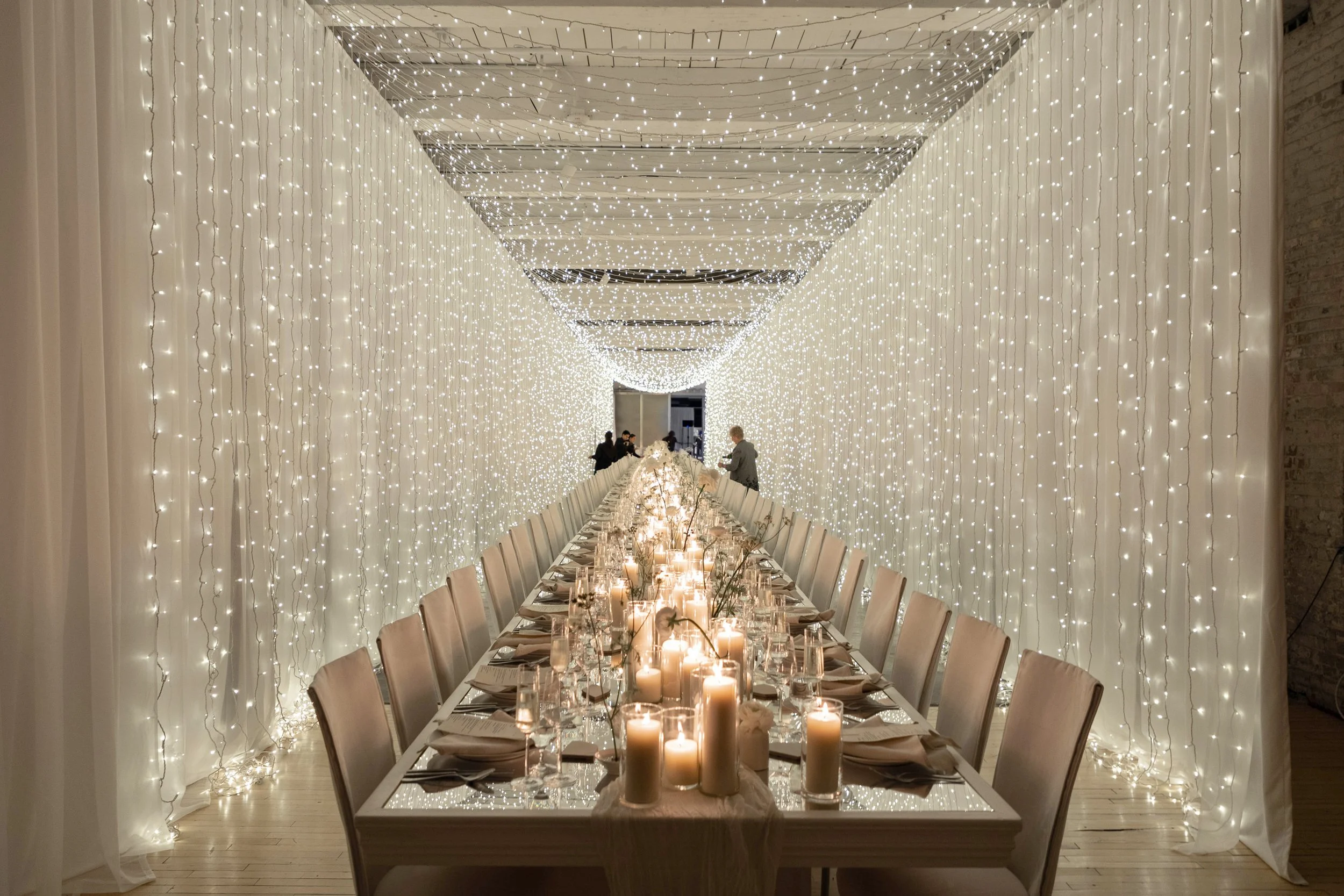 Berkshire wedding reception setup with long candlelit tables and soft lighting